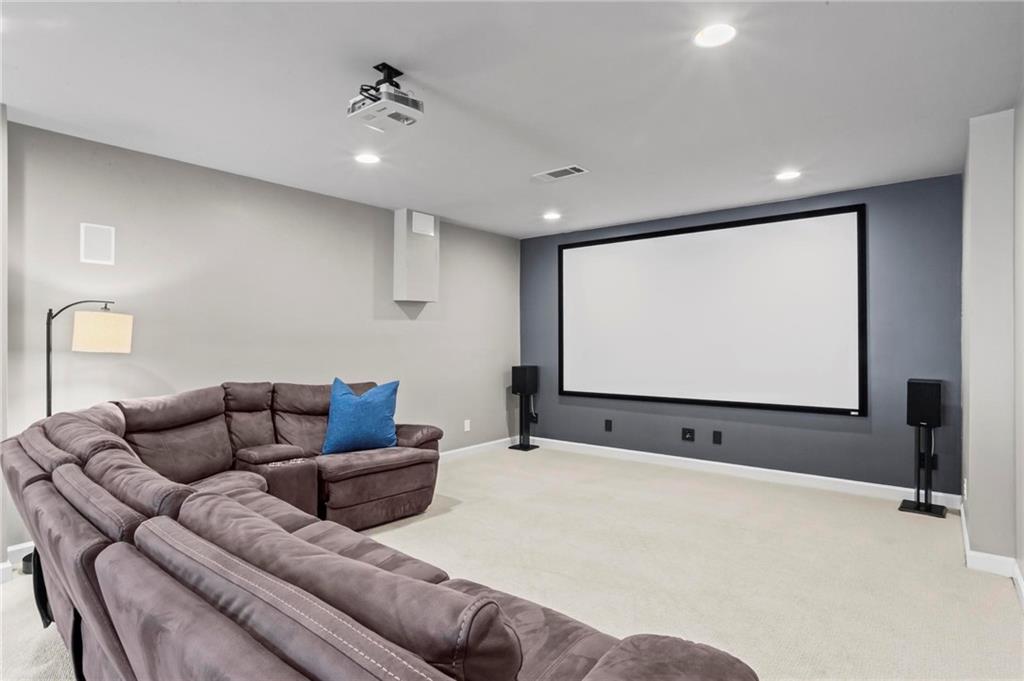 14375 Morning Mountain Way Milton, GA 30004 - Photo 38 of 53 a projector room with furniture