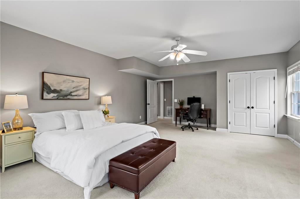 14375 Morning Mountain Way Milton, GA 30004 - Photo 43 of 53 a bed room with furniture and a chandelier