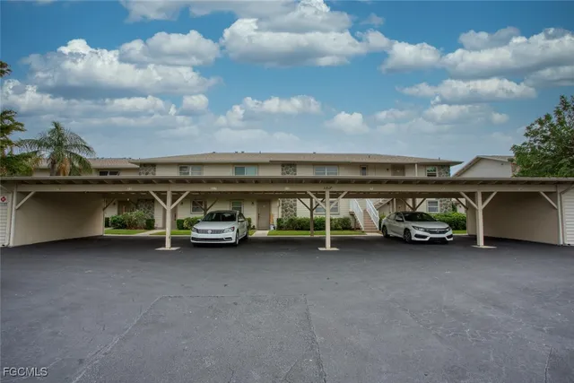 a kitchen with stainless steel appliances granite countertop a sink and a stove