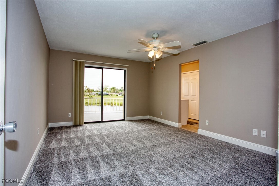 5917 Littlestone Court, Unit 118 North Fort Myers, FL 33903 - Photo 14 of 20 a view of an empty room with a window