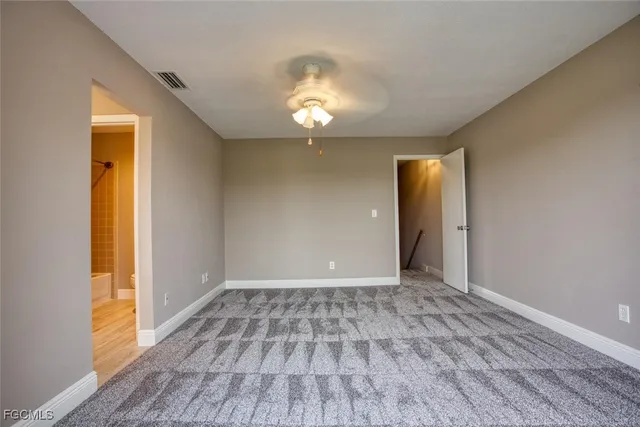 a bathroom with a toilet and a bathtub