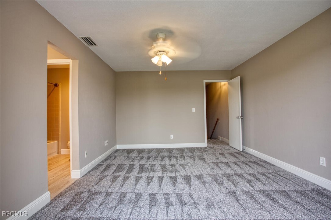 5917 Littlestone Court, Unit 118 North Fort Myers, FL 33903 - Photo 15 of 20 wooden floor in an empty room with a window