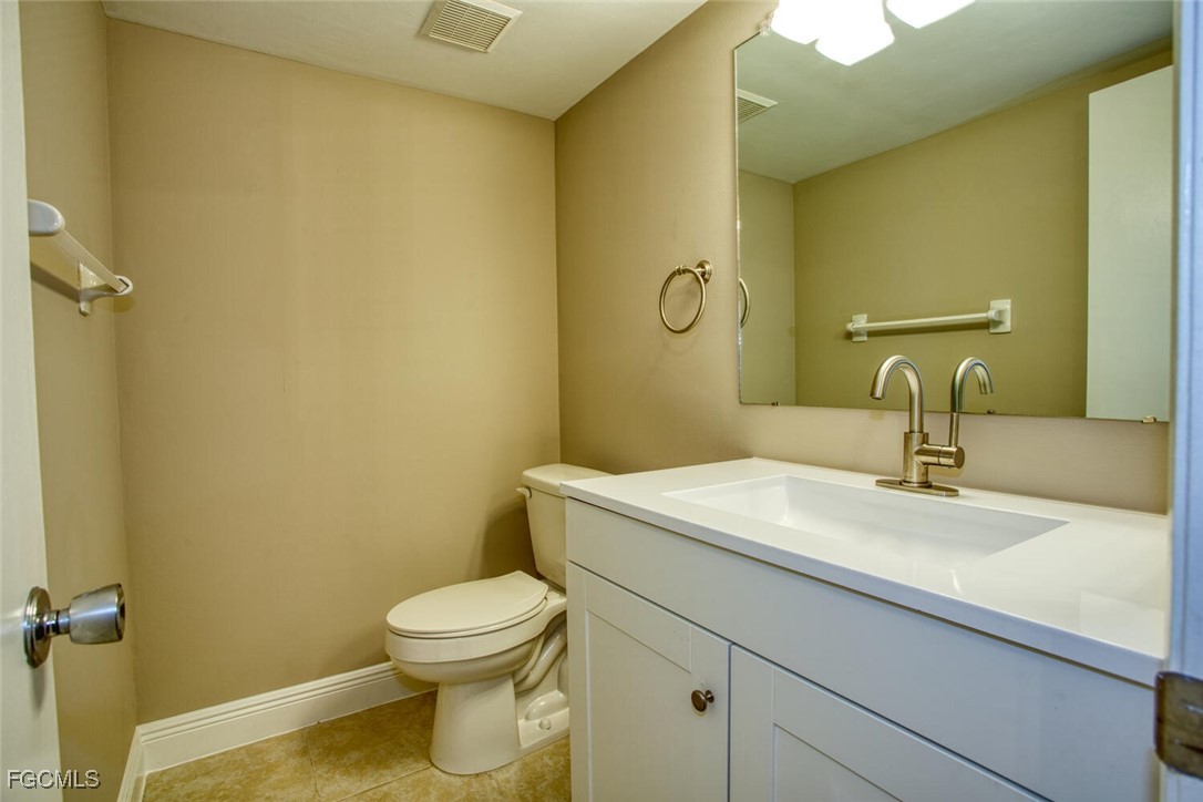 5917 Littlestone Court, Unit 118 North Fort Myers, FL 33903 - Photo 8 of 20 a bathroom with a sink and a toilet