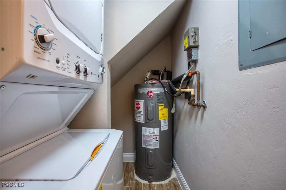 5917 Littlestone Court, Unit 118 North Fort Myers, FL 33903 - Photo 9 of 20 a utility room with dryer and washer