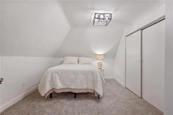 a bedroom with a bed and a table