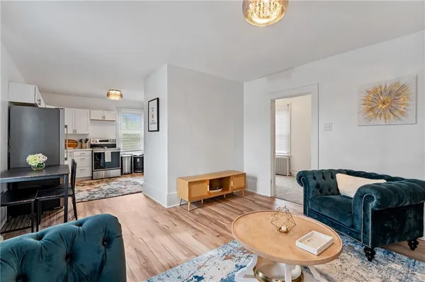 a living room with furniture and a table