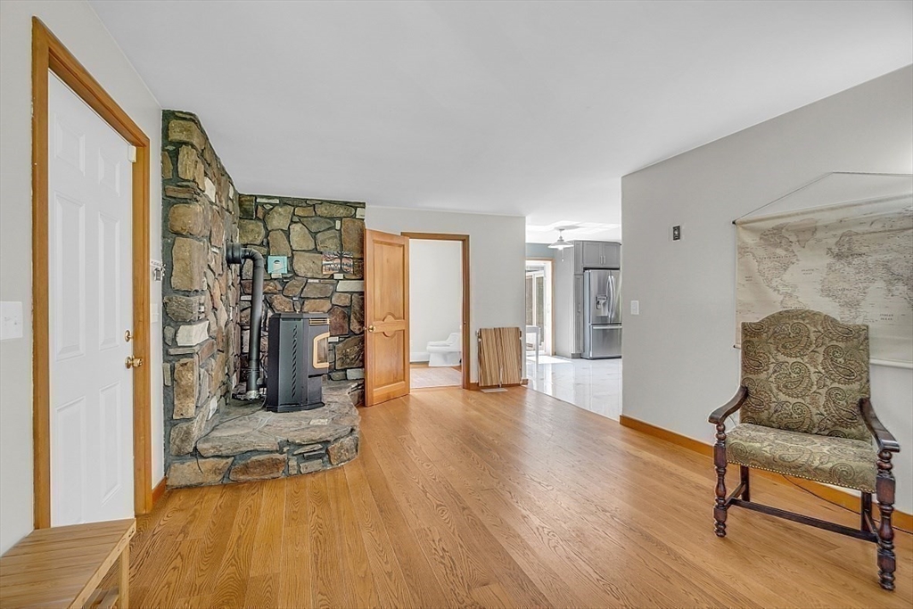 73 Off Ruggles Street Gilbertville, MA 01031 - Photo 16 of 38 a living room with furniture and a wooden floor