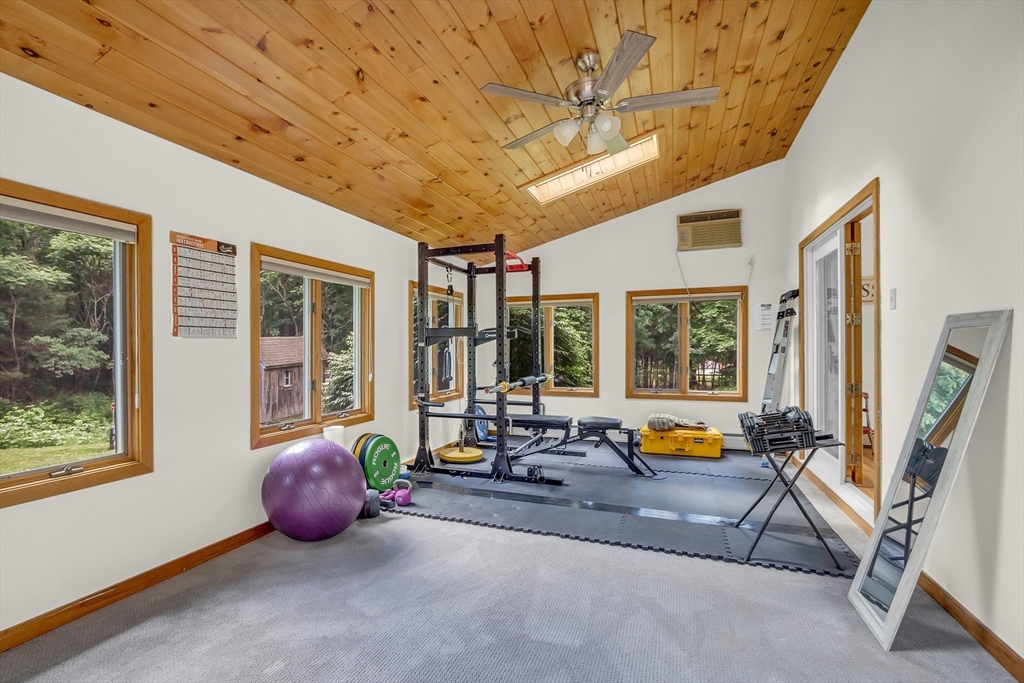 73 Off Ruggles Street Gilbertville, MA 01031 - Photo 20 of 38 a living room with furniture and large windows