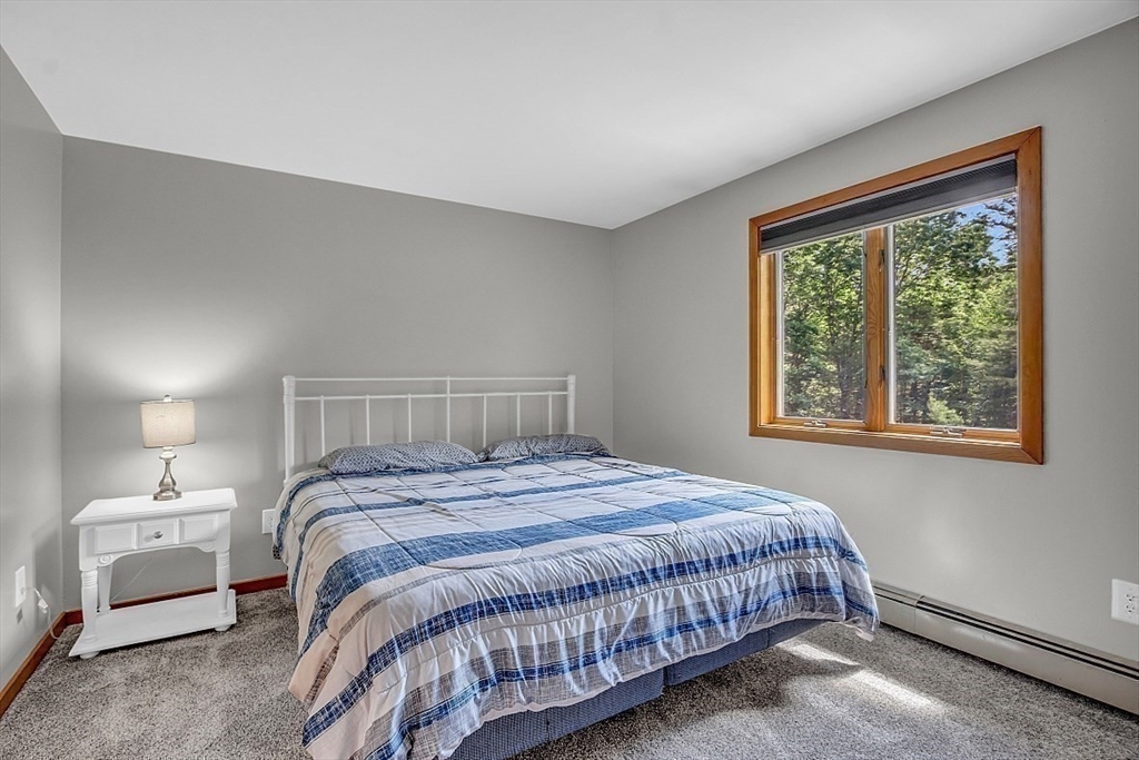 73 Off Ruggles Street Gilbertville, MA 01031 - Photo 30 of 38 a bedroom with a bed and a window