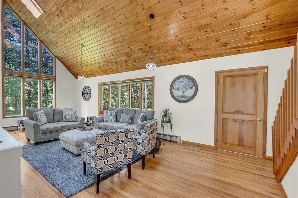 73 Off Ruggles Street Gilbertville, MA 01031 - Photo 3 of 38 a living room with furniture and a large window