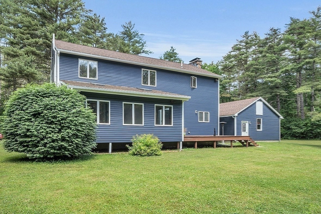 73 Off Ruggles Street Gilbertville, MA 01031 - Photo 32 of 38 a front view of a house with a yard