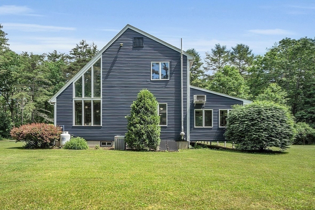 73 Off Ruggles Street Gilbertville, MA 01031 - Photo 34 of 38 a front view of a house with garden