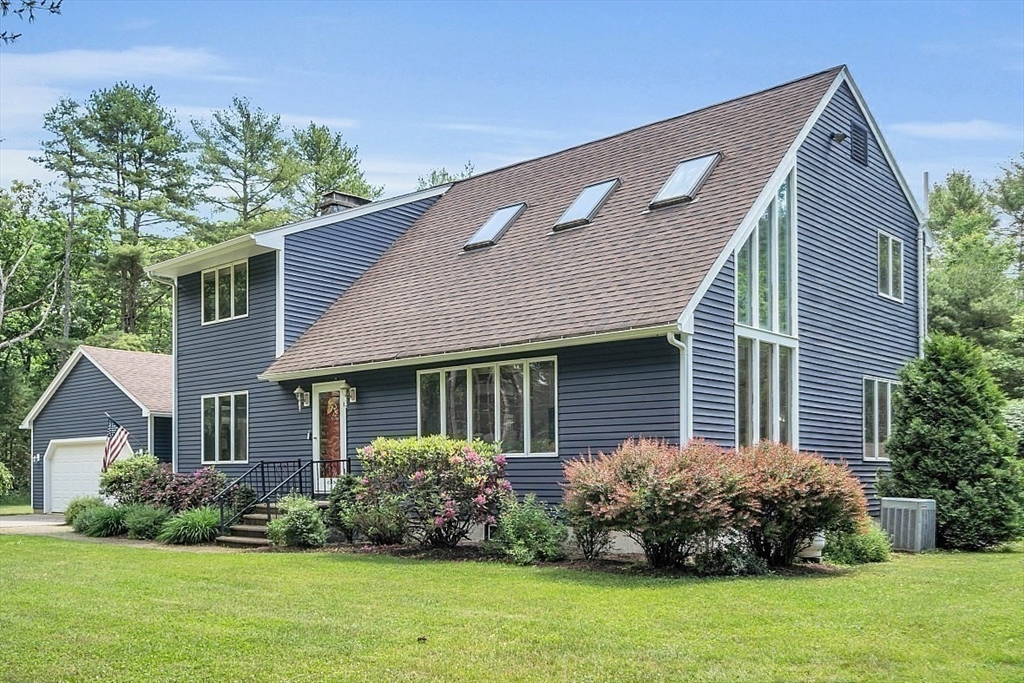 73 Off Ruggles Street Gilbertville, MA 01031 - Photo 38 of 38 a front view of a house with a garden