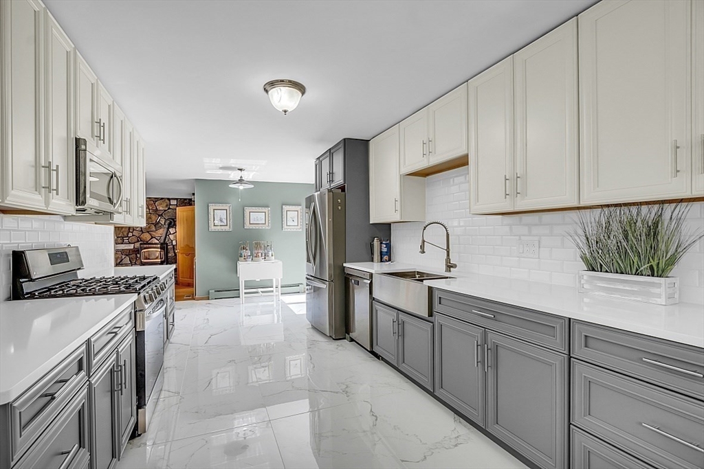 73 Off Ruggles Street Gilbertville, MA 01031 - Photo 6 of 38 a kitchen with sink cabinets and stove