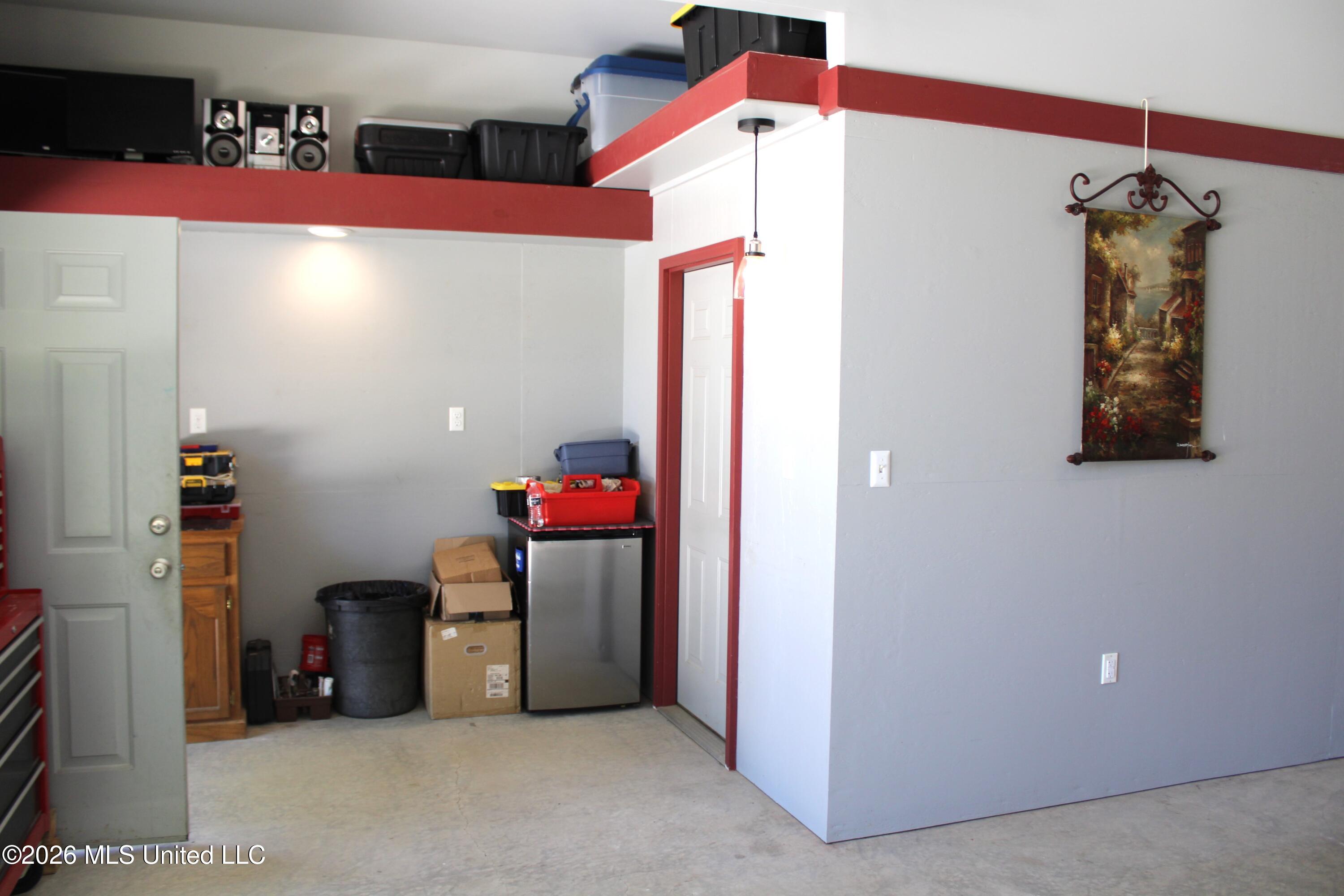 2934 North Red Banks Road Byhalia, MS 38611 - Photo 30 of 42 Workshop Interior with Storage Room