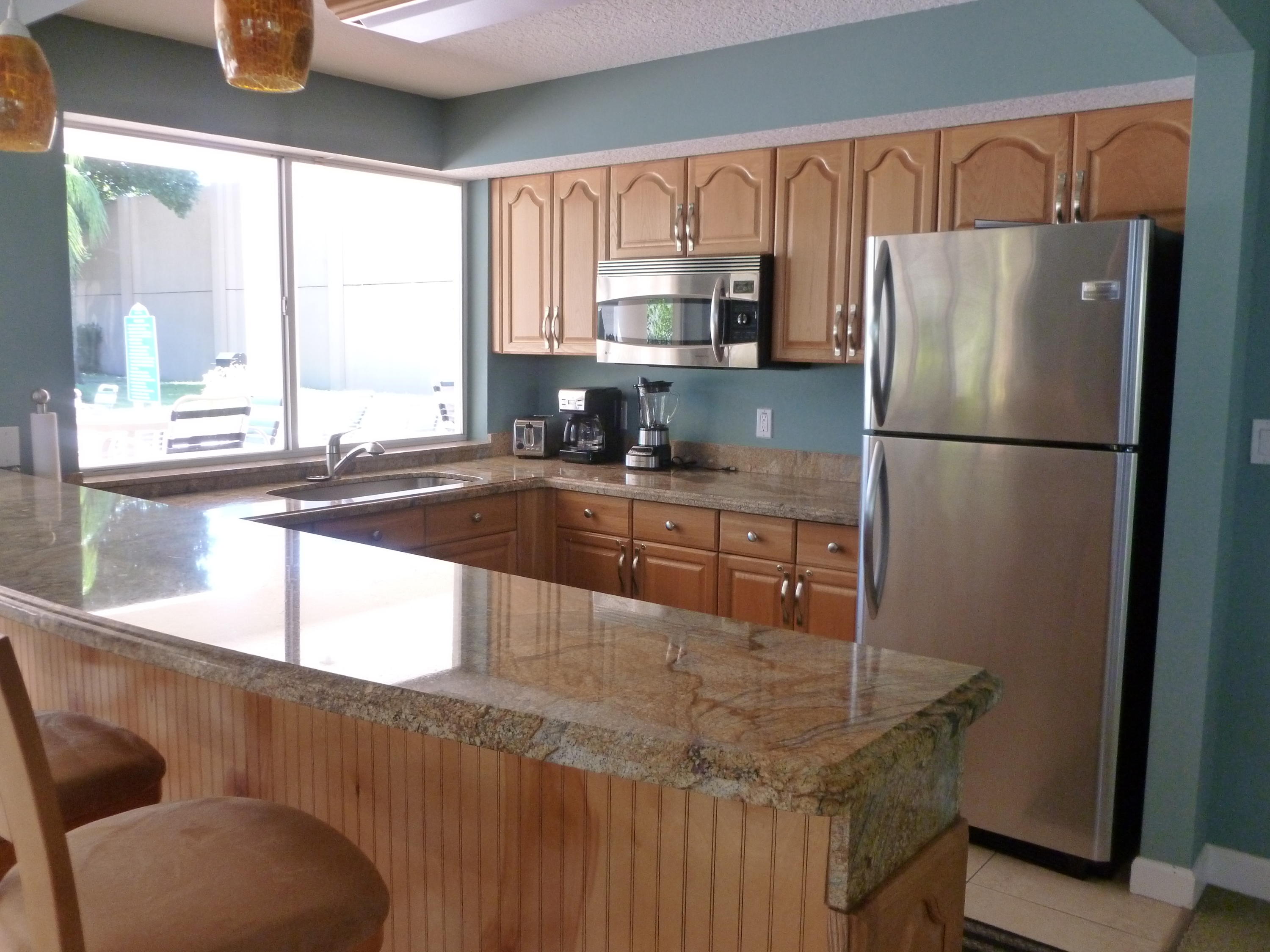 340 Northwest 67th Street, Unit 102 Boca Raton, FL 33487 - Photo 17 of 18 Clubhouse Kitchen