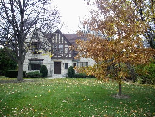 a view of house with yard