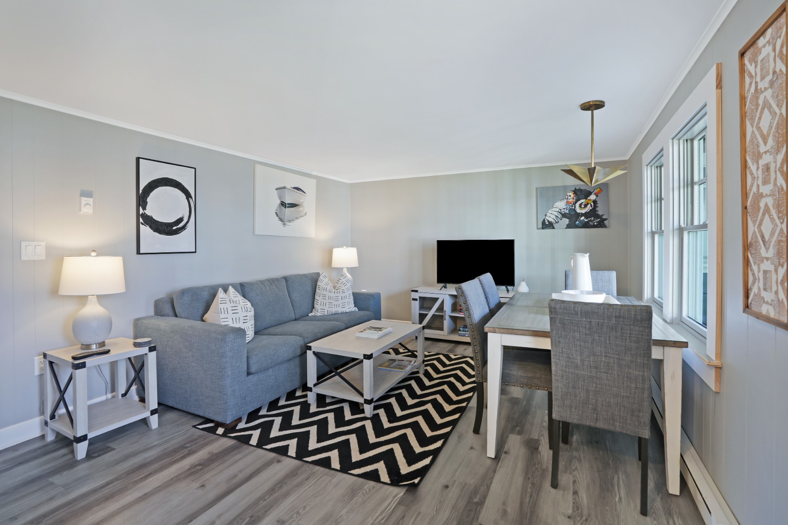 20 Peases Point Way North, Unit 4 Edgartown, MA 02539 - Photo 1 of 11 a living room with furniture a fireplace and a flat screen tv