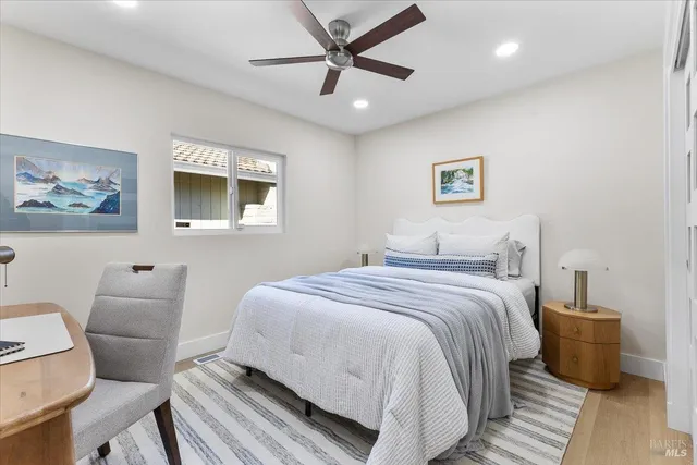 a bedroom with a bed and a dresser