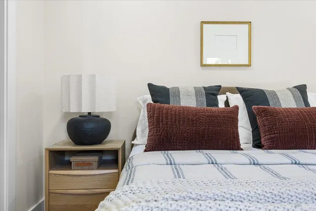 a backyard of a house with table and chairs