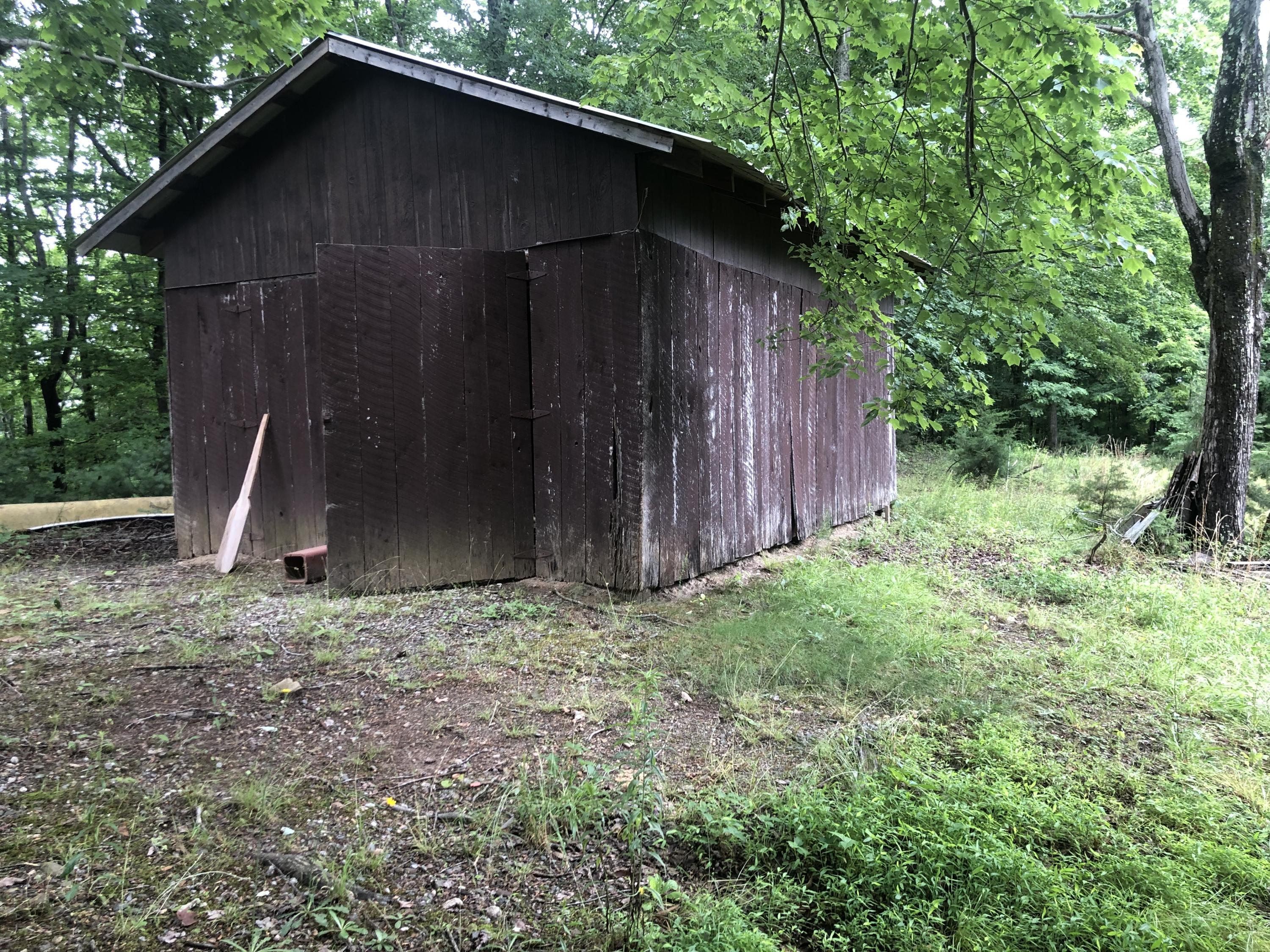 1070 Philpott Road Henry, VA 24102 - Photo 17 of 22 a backyard of a house with lots of green space