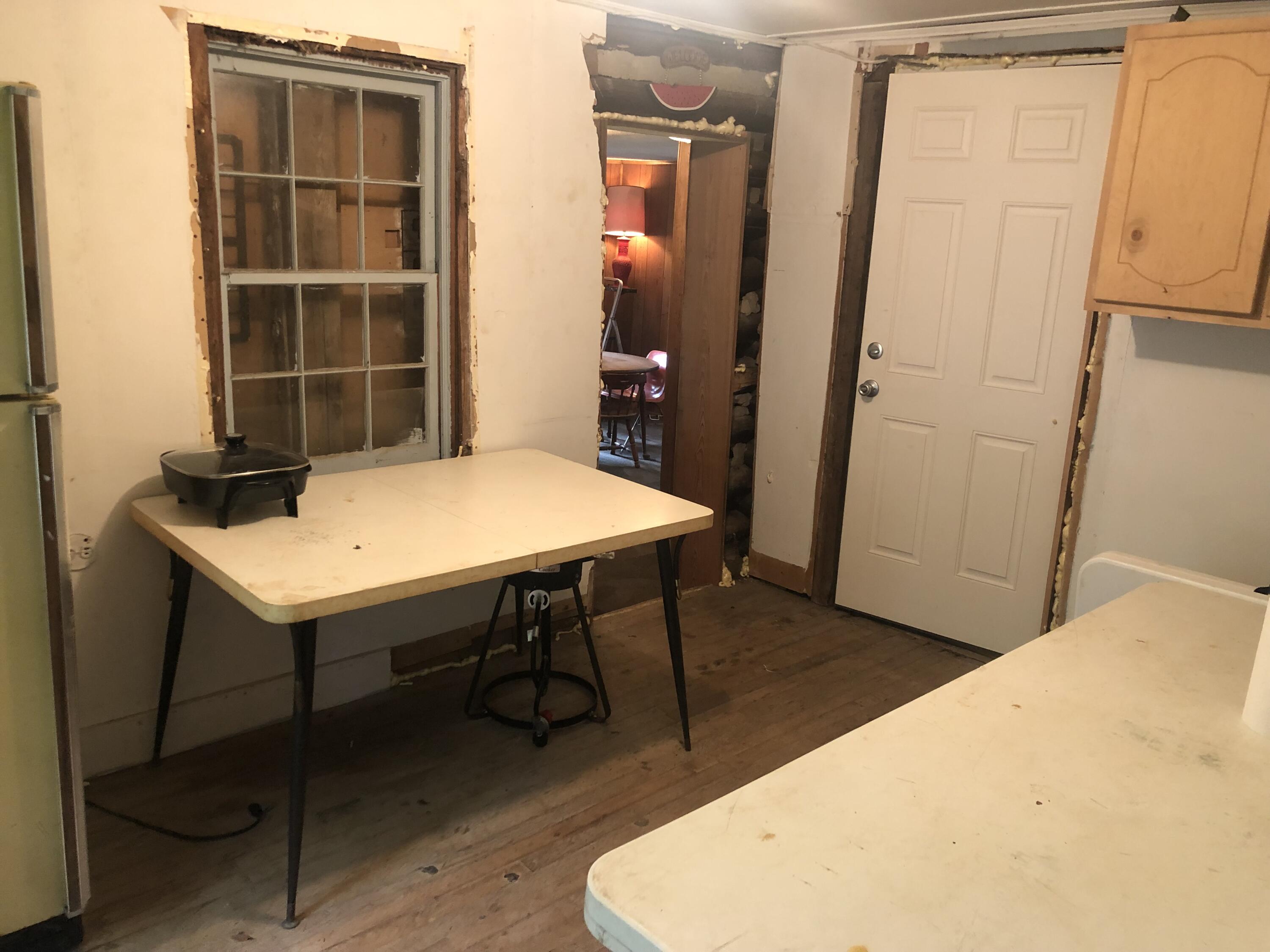 1070 Philpott Road Henry, VA 24102 - Photo 7 of 22 a view of a room that has a table and chairs in it