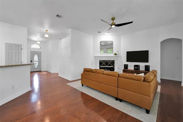 a living room with furniture and a flat screen tv