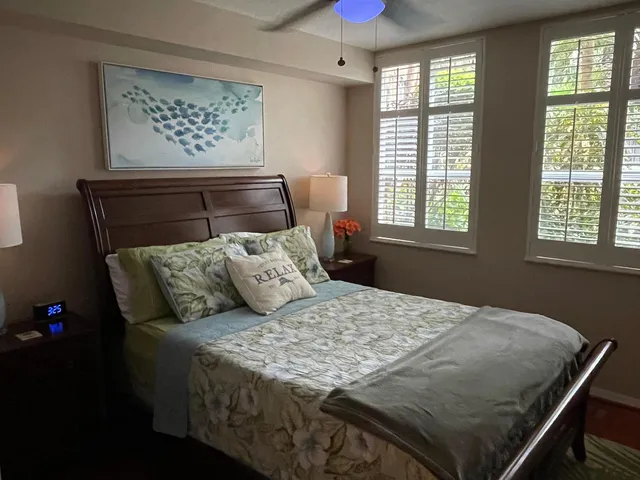 a bedroom with a bed and window