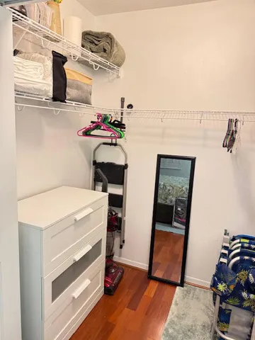 a view of utility room with racks on the wall