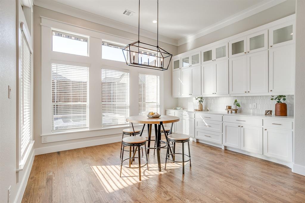 13921 Riviera East Fort Worth, TX 76028 - Photo 17 of 40 a view of a dining room with furniture window and wooden floor