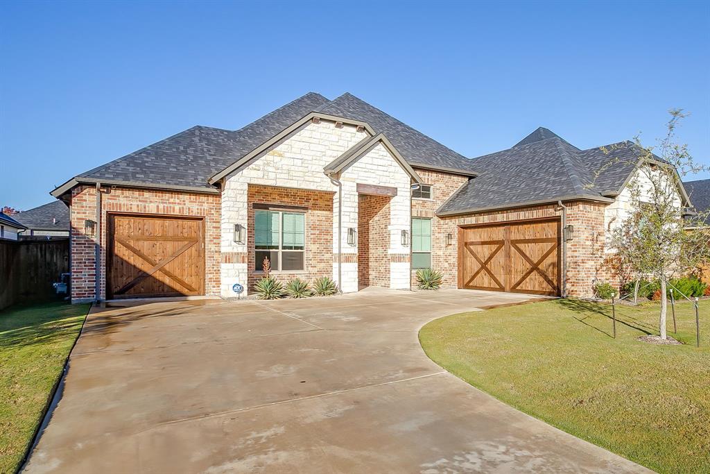 13921 Riviera East Fort Worth, TX 76028 - Photo 2 of 40 a view of a house with a tub and a garden