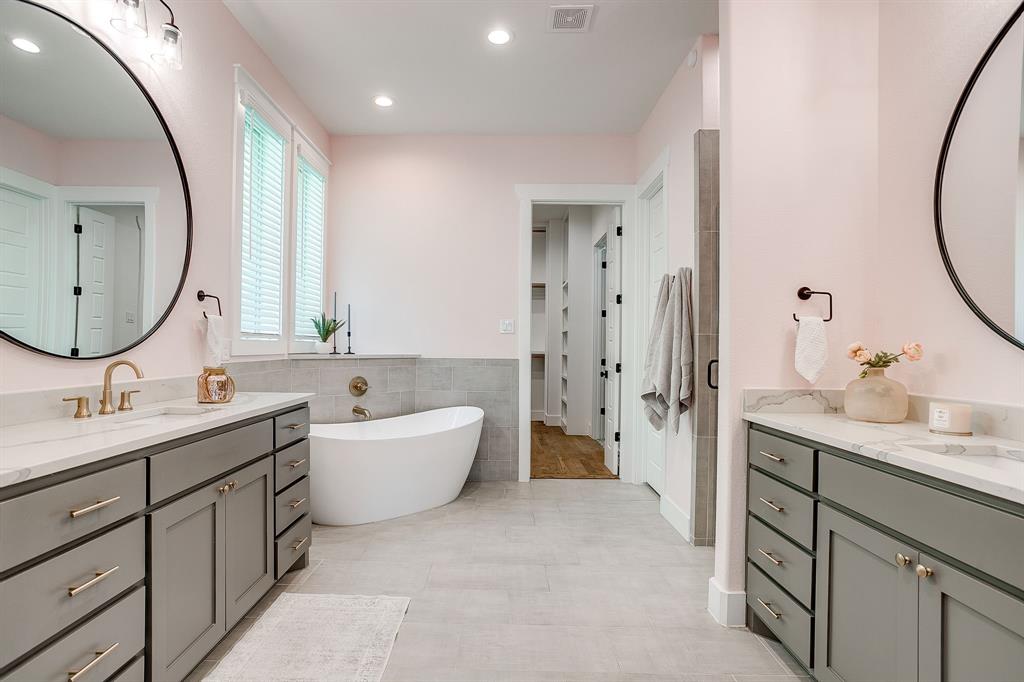 13921 Riviera East Fort Worth, TX 76028 - Photo 23 of 40 a bathroom with a double vanity sink mirror and bathtub