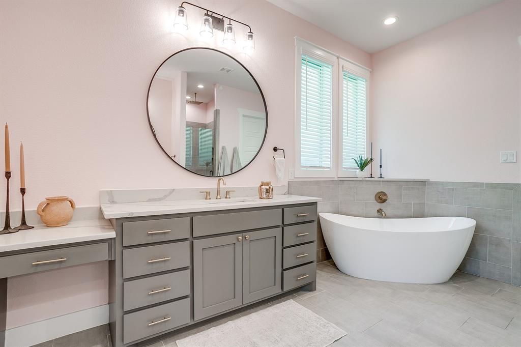 13921 Riviera East Fort Worth, TX 76028 - Photo 24 of 40 a bathroom with a tub sink and mirror