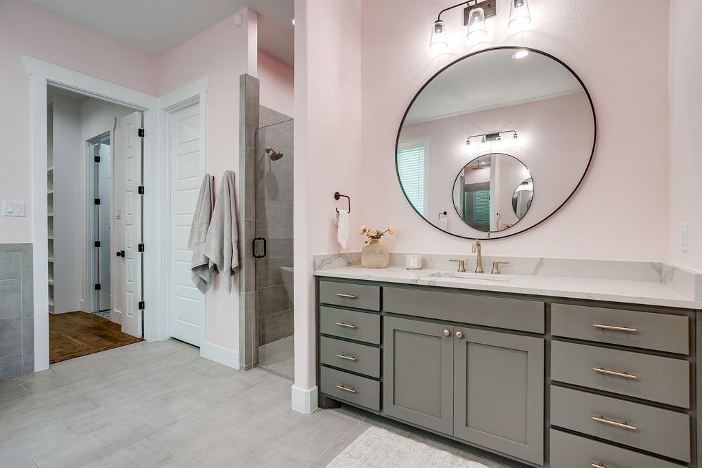 13921 Riviera East Fort Worth, TX 76028 - Photo 26 of 40 a bathroom with a sink and a mirror