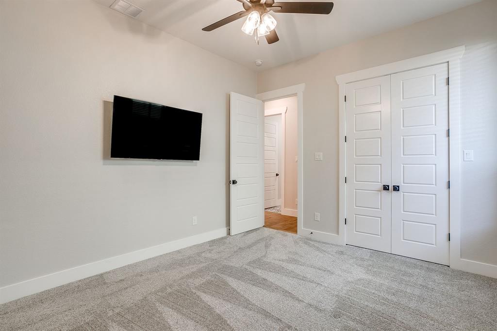 13921 Riviera East Fort Worth, TX 76028 - Photo 32 of 40 a view of a livingroom with a flat screen tv