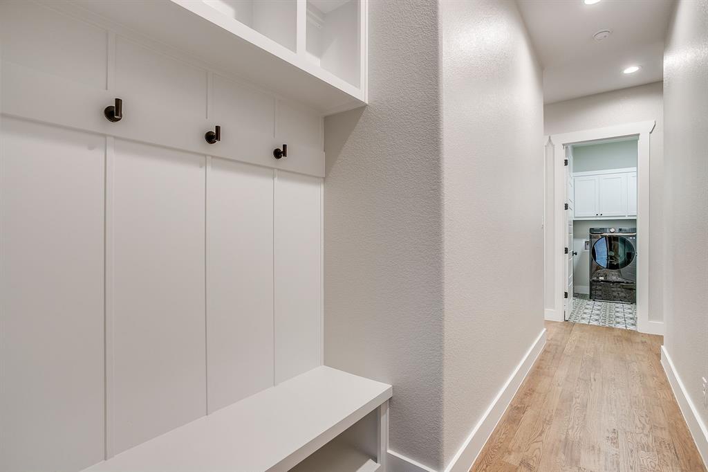 13921 Riviera East Fort Worth, TX 76028 - Photo 34 of 40 a view of a hallway with wooden floor and closet