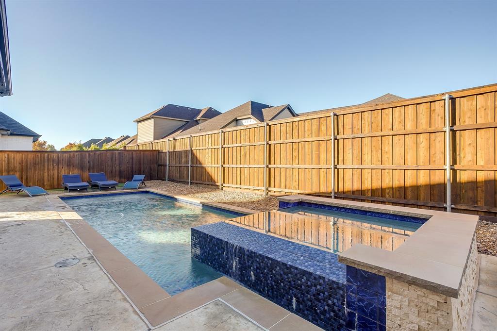 13921 Riviera East Fort Worth, TX 76028 - Photo 36 of 40 a view of a backyard with swimming pool and sitting area