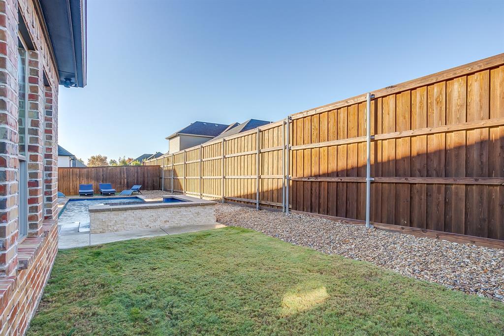 13921 Riviera East Fort Worth, TX 76028 - Photo 38 of 40 a view of a backyard