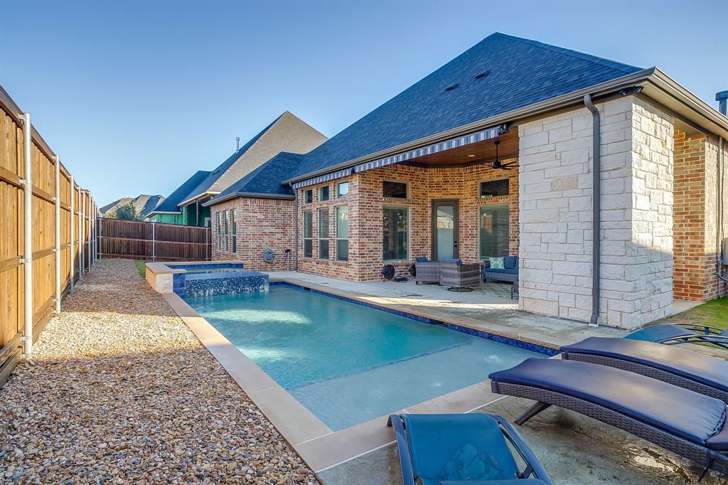 13921 Riviera East Fort Worth, TX 76028 - Photo 39 of 40 a front view of house with deck and outdoor seating