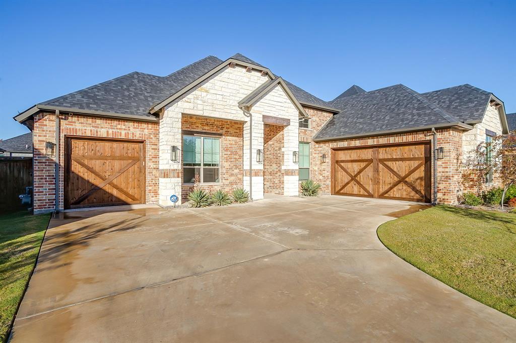 13921 Riviera East Fort Worth, TX 76028 - Photo 4 of 40 a view of outdoor space yard and garage