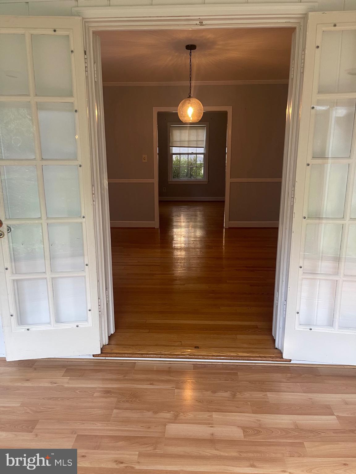5528 Warwick Place Chevy Chase, MD 20815 - Photo 21 of 68 Sunroom to Dining Room to Living Room view