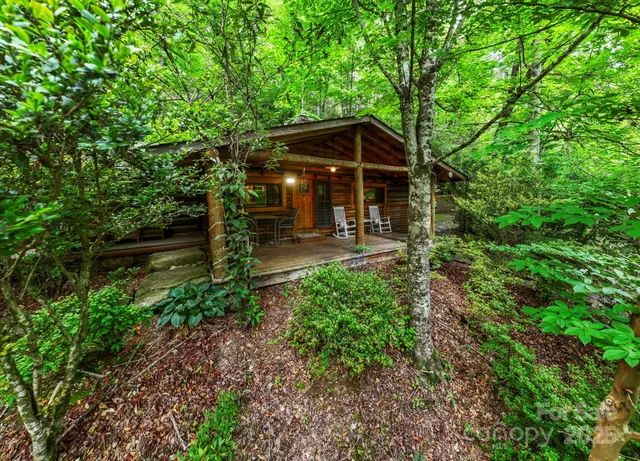 a view of a chair and table and chairs under an umbrella