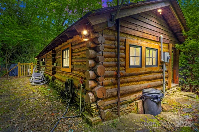a view of a backyard with table and chairs and potted plants