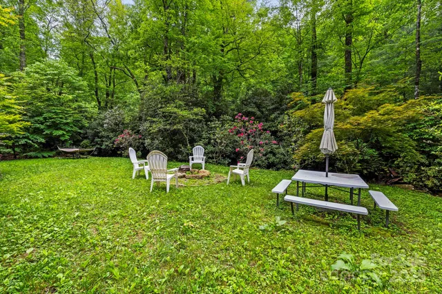 a white bench sitting in the middle of a park