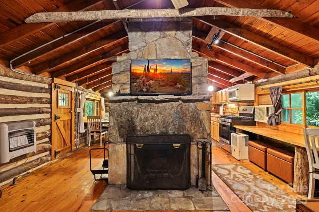 a view of a fireplace with wooden floor