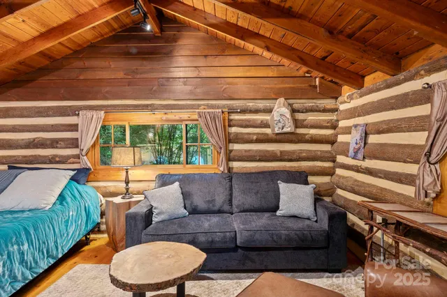 a bed sitting in a room next to a buildings