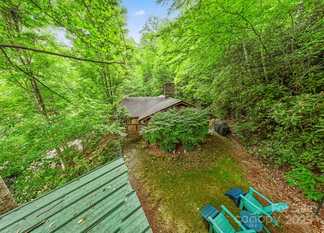 a backyard of a house with lots of green space