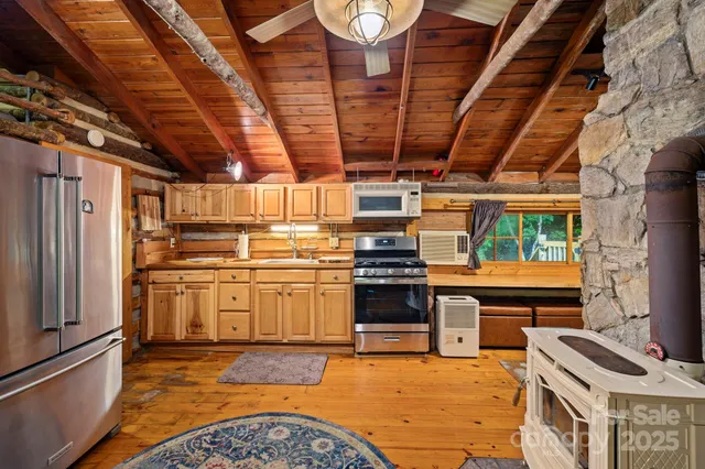 a kitchen with a stove and a refrigerator