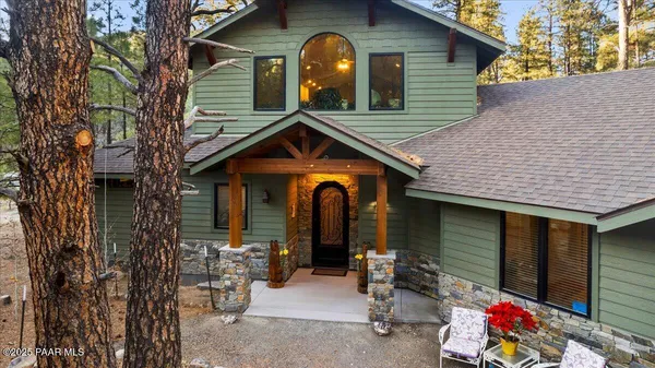 a front view of a house with outdoor space