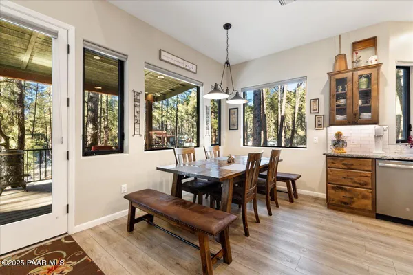 a view of a dining room with furniture window and outside view
